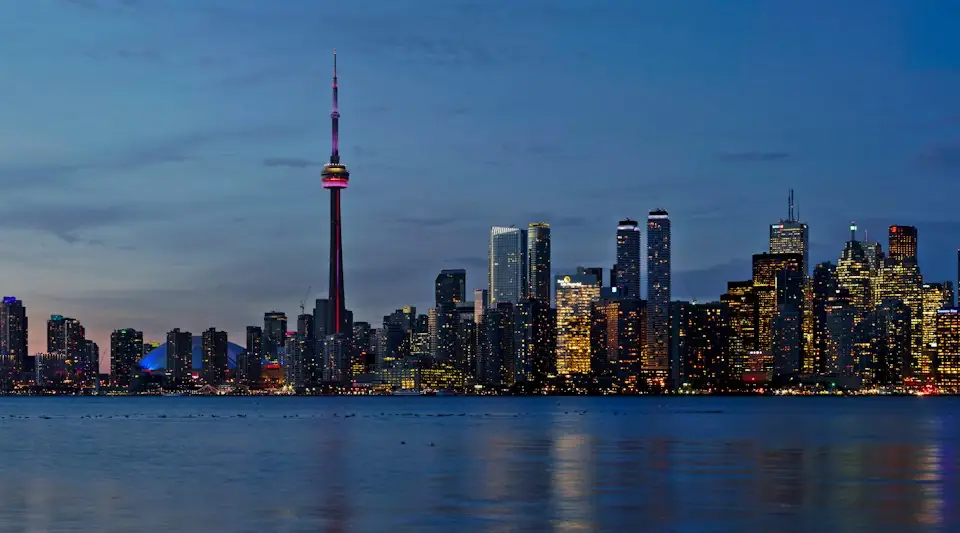Toronto skyline and CN Tower lit up at night