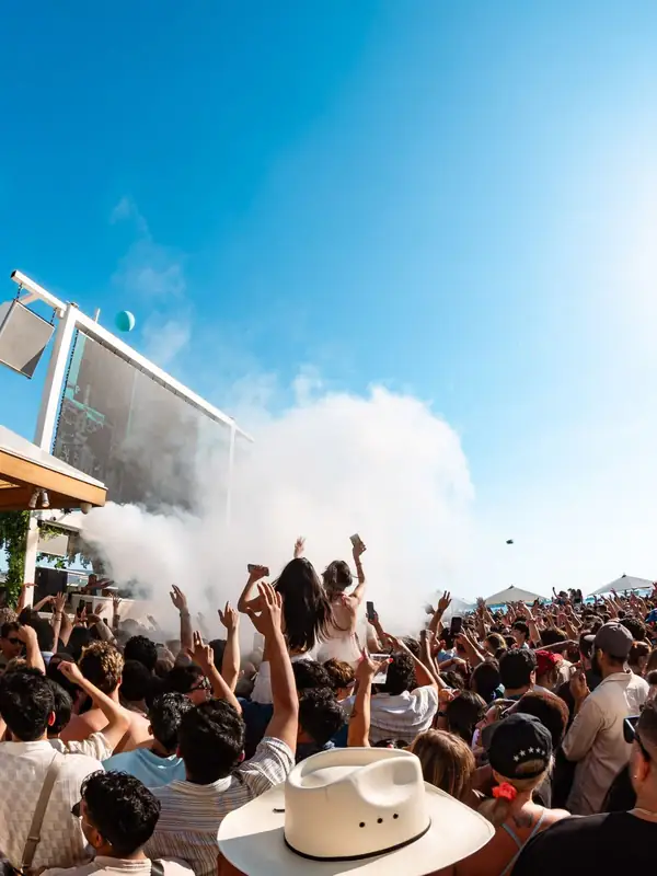 Crowd and CO2 blast at a Cabana Pool Bar day party on Toronto's waterfront