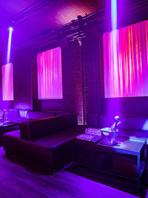 Purple-lit VIP booths at Century nightclub Toronto