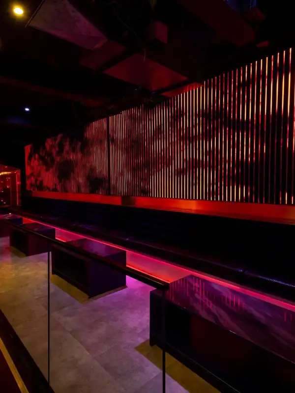 Red-lit lounge seating at DPRTMNT Toronto