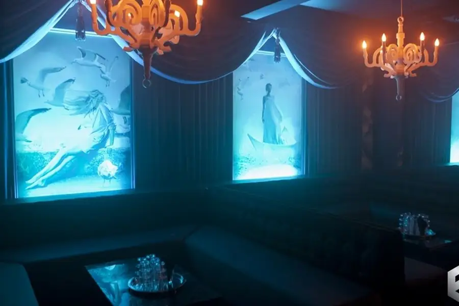 Lounge booths and chandelier inside Fiction nightclub on Pearl Street