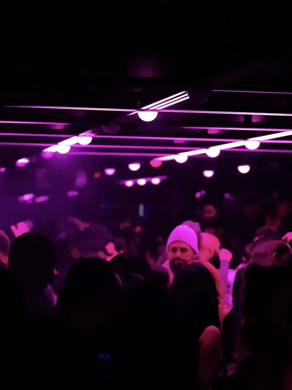 Crowd under purple lights at Infinity Room, below Future on Queen Street West