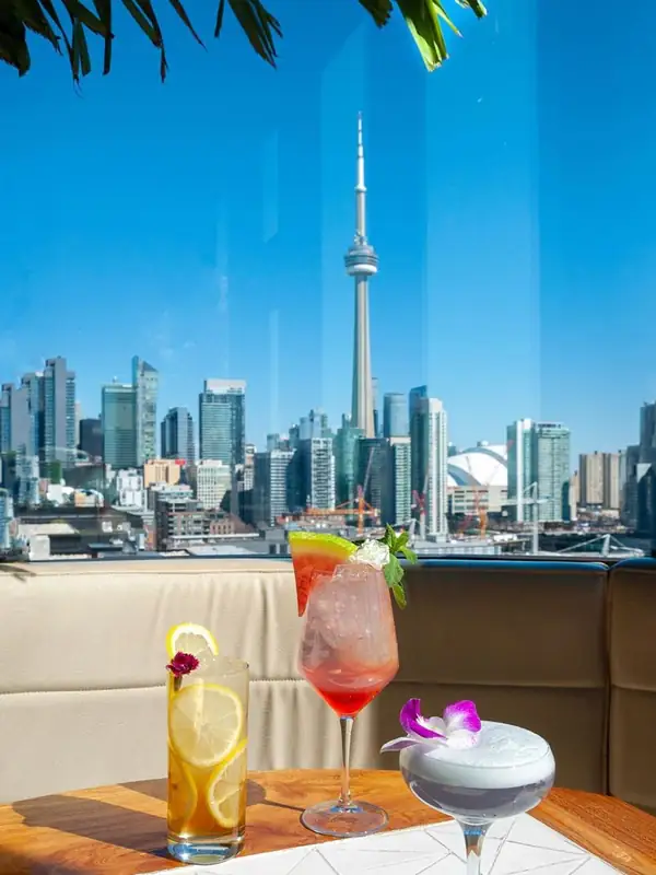 Cocktails with a CN Tower skyline view at Lavelle rooftop on King Street West