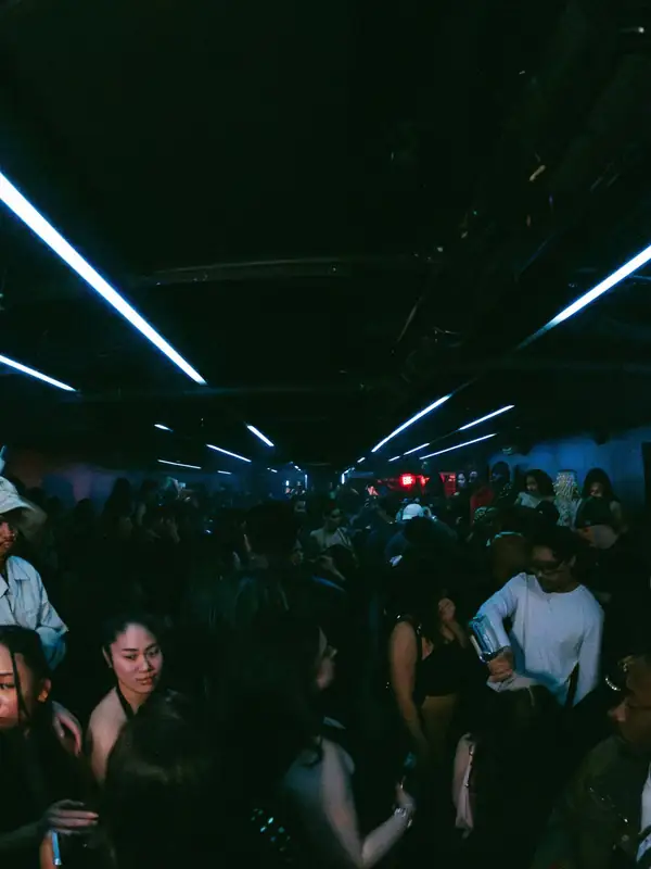 Crowd under light beams at Lost & Found nightclub on King Street West