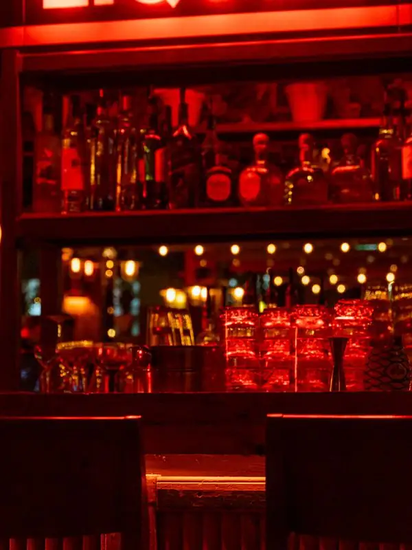 Backlit bar shelves at Petty Cash Toronto