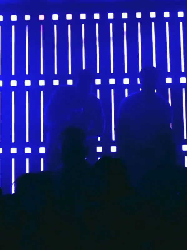 Blue light wall and silhouettes at Ultraviolet nightclub on Queen Street West